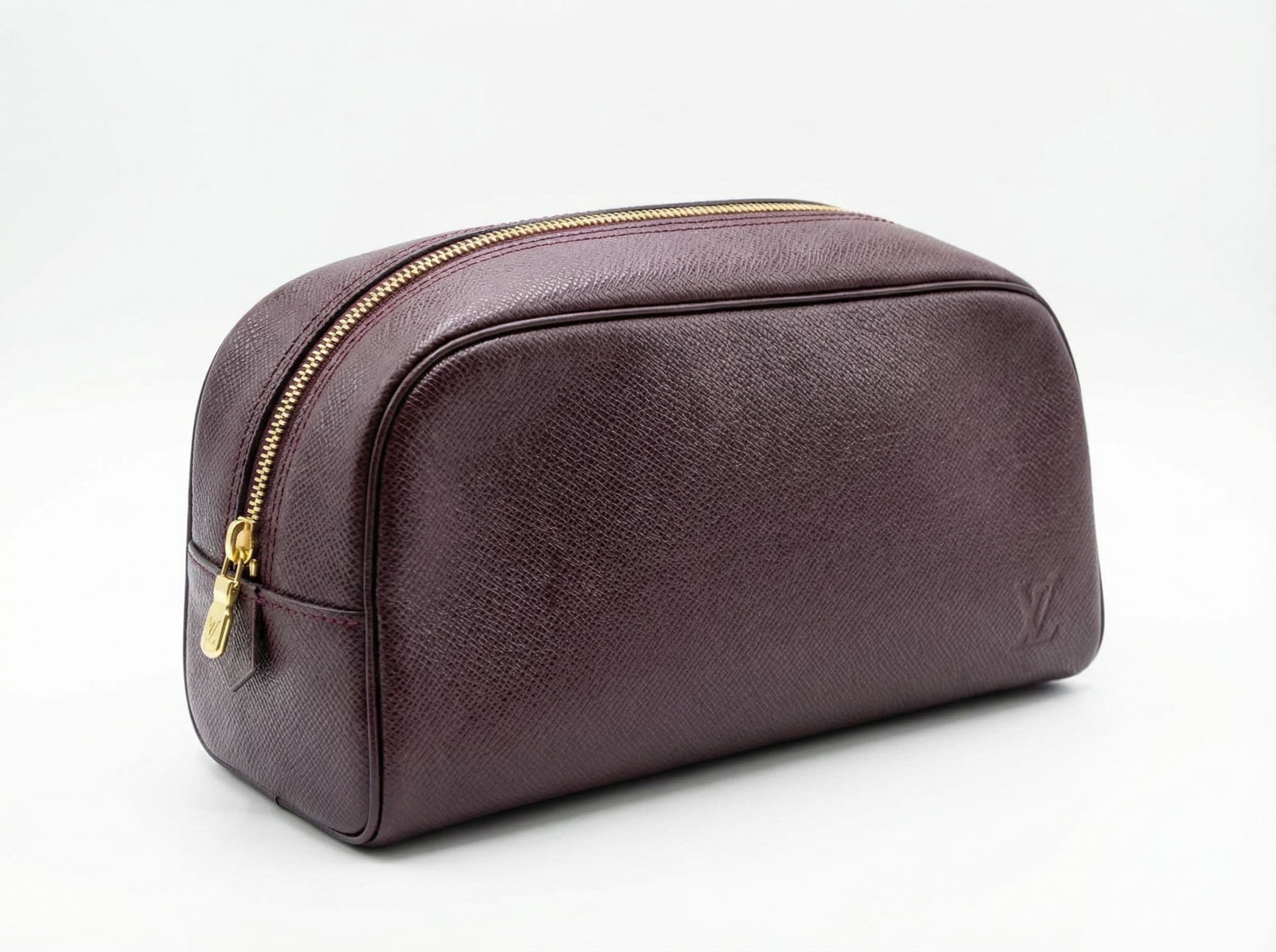 Louis Vuitton True Toilette PM Taiga Bordeaux - Image 1